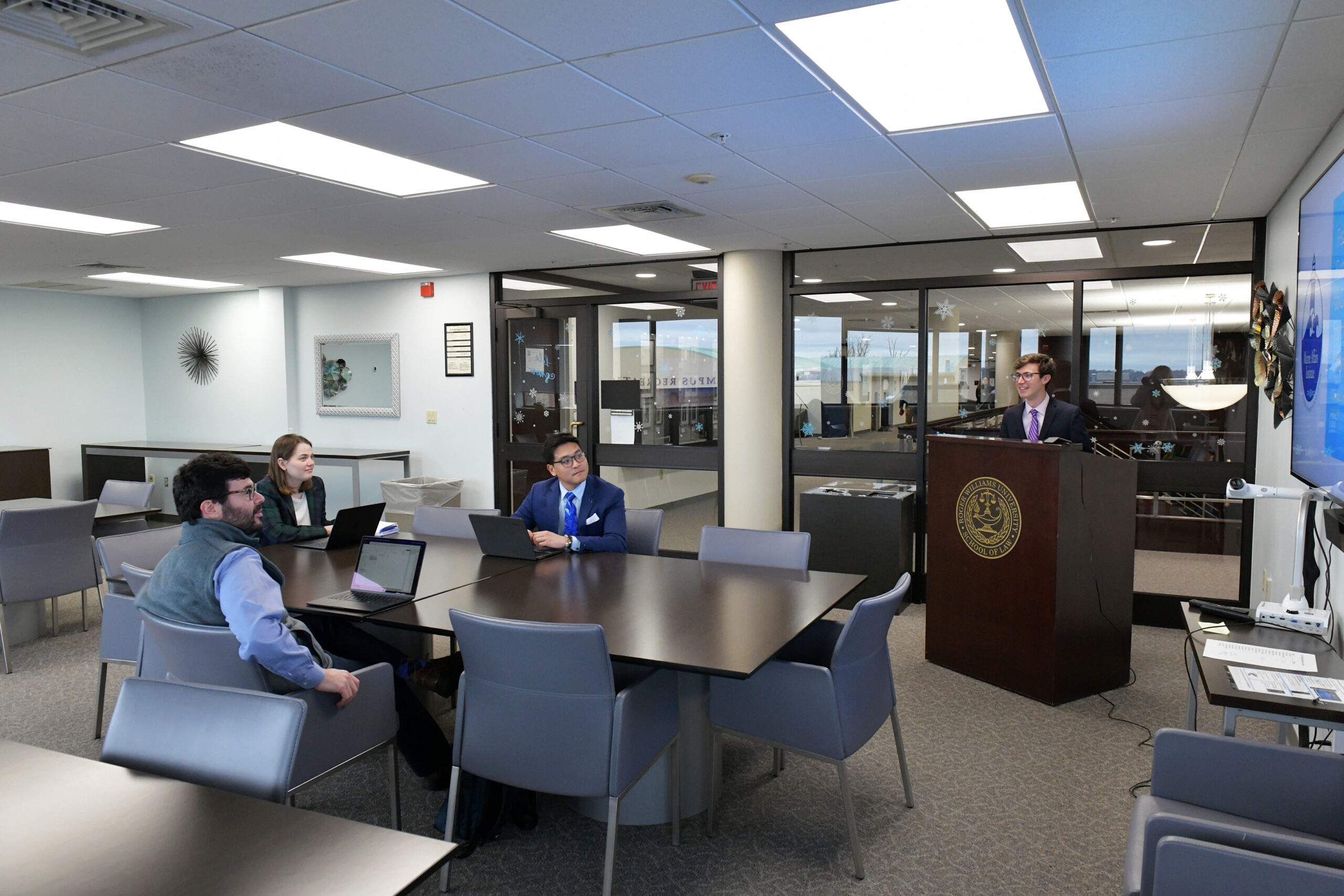 Legal program research attorney presents resarch to audience at Roger Williams University