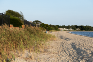 A depression in the sand at Barrington Beach caused by the energy of waves hitting sea walls