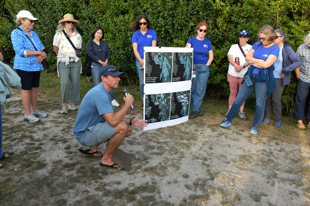 Nathan Vinhateiro shows aerial views of where Barrington shoreline access sites will be impacted by sea level rise. 