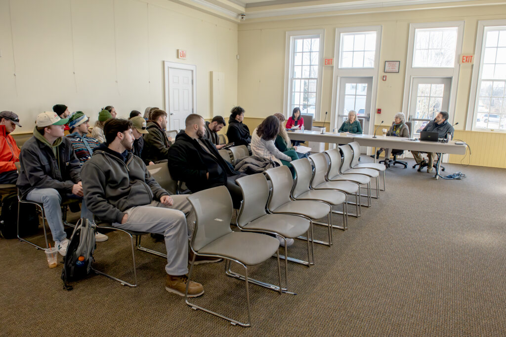 Students assemble in Jamestown Town Council chambers to hear about Mackerel Cove sea level rise issues