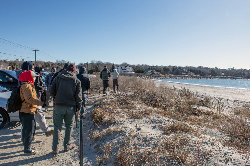 Landscape architecture students gather at Mackerel Cove Beach on a winter morning