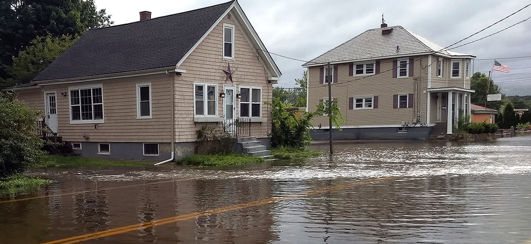 Two-story homes along a flooded street