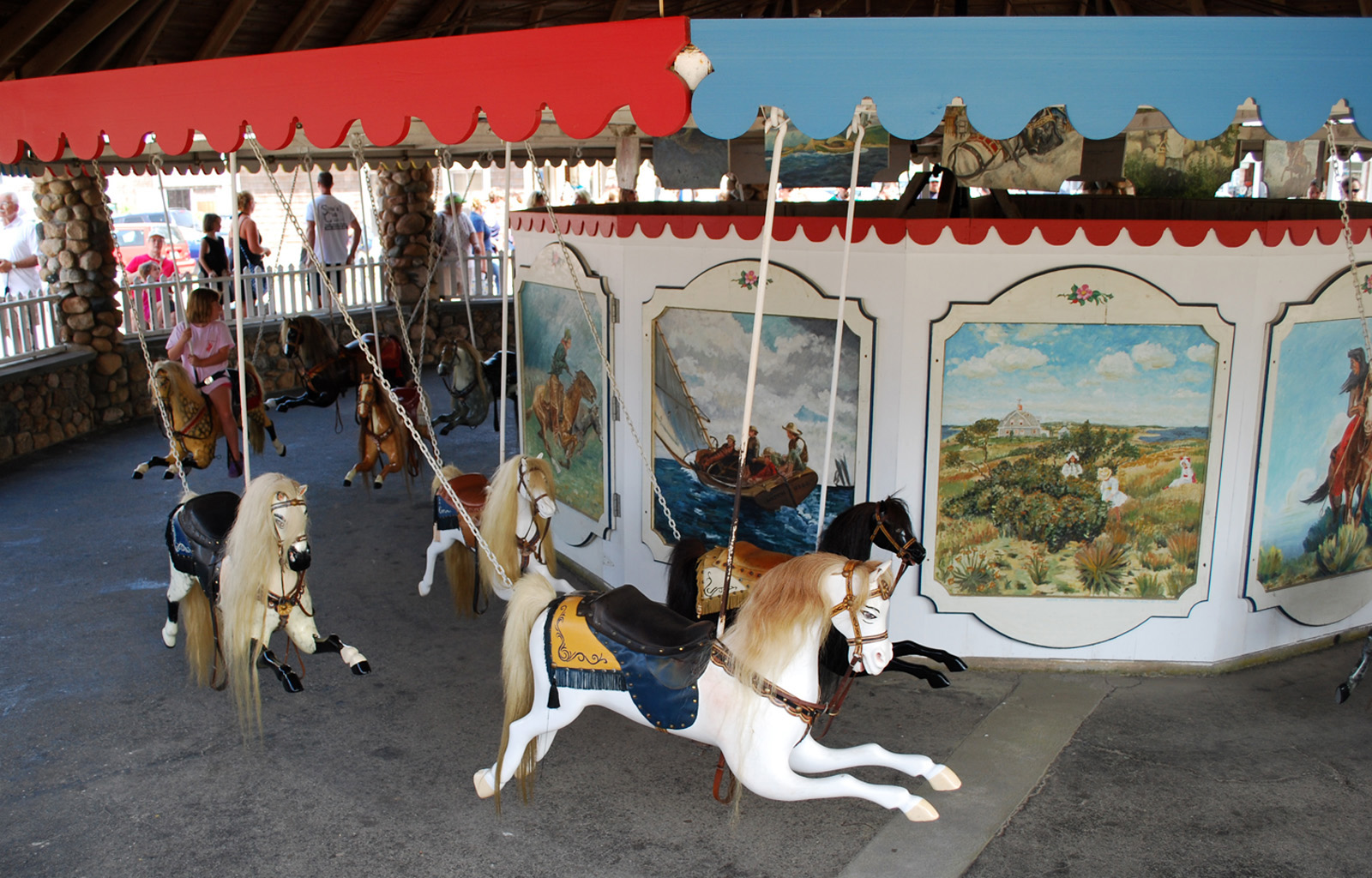 Watch-Hill-RI-1884-historic-carousel-Dare-swing-ride-12 View of carousel horses at The Flying Horse Carousel in Westerly