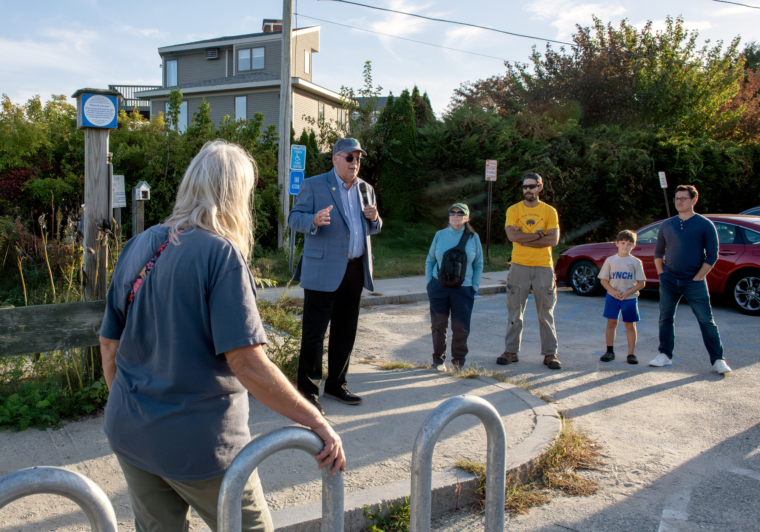 DSC_8121 State Sen. Mark McKenney speaks to a group of walk participants in front of  a shoreline right-of-way sign